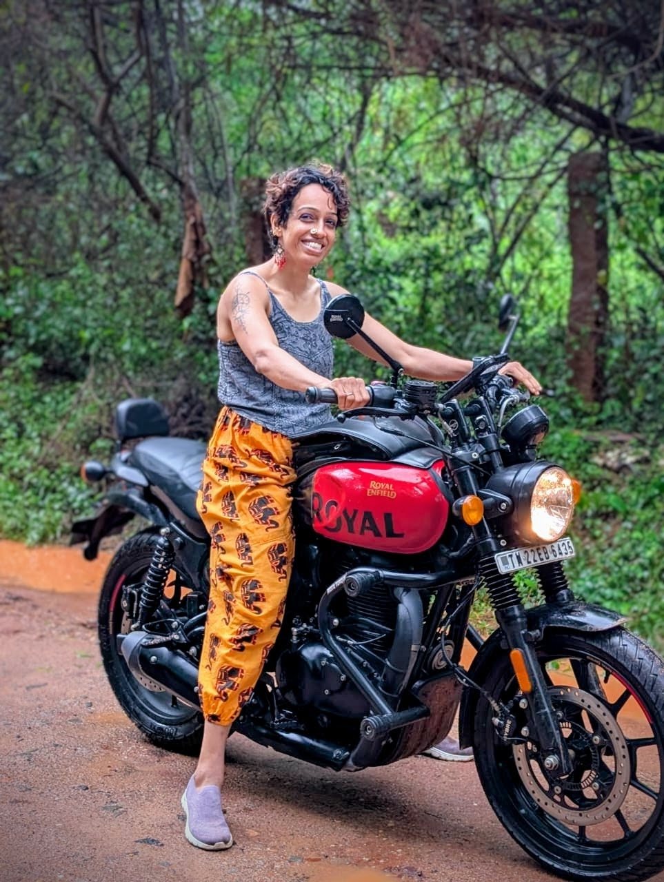 KP on her Royal Enfield on a forest road